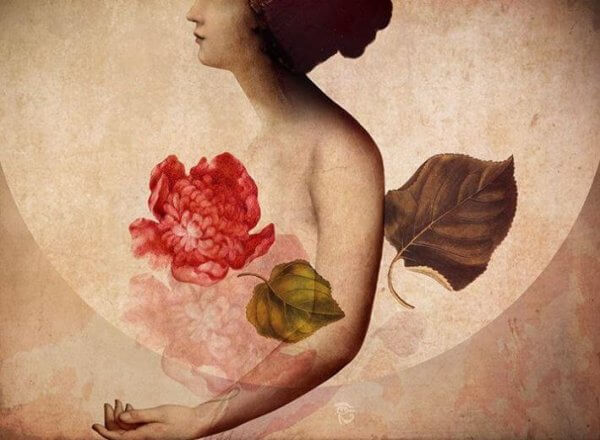 Kvinne holder blomst