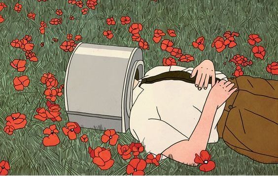 mann ligger i blomstereng