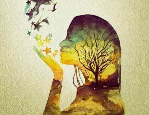 Siluett av jente som blåser stjerner