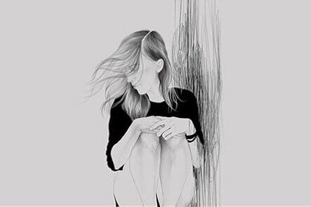 Jente sitter med vind i håret