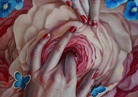 Hender rører blomst