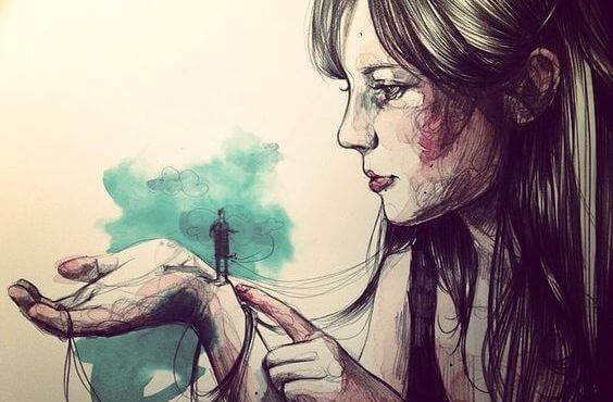 Kvinne med liten mann i hånden