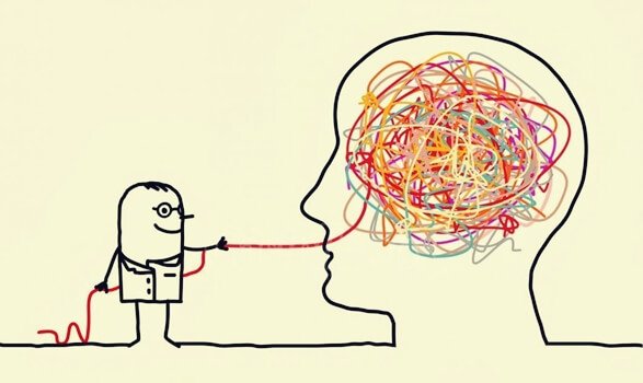 Mann drar ut tråder fra et hode