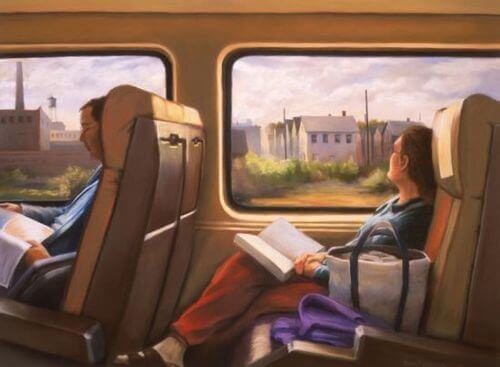 Kvinne leser på toget