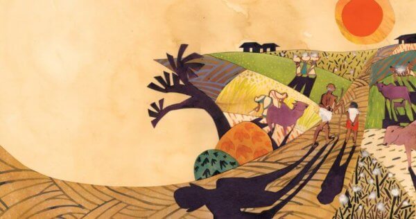 Gandhi går med en tilhenger ned en fargerik indisk vei