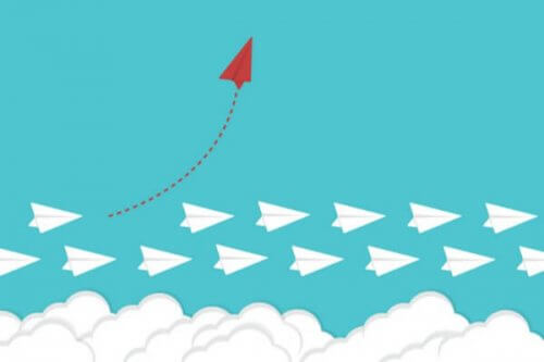 Rødt papirfly som representerer lyst til å forandre en vane