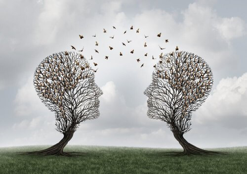 To trær i form av menneskelige hoder med fugler mellom.
